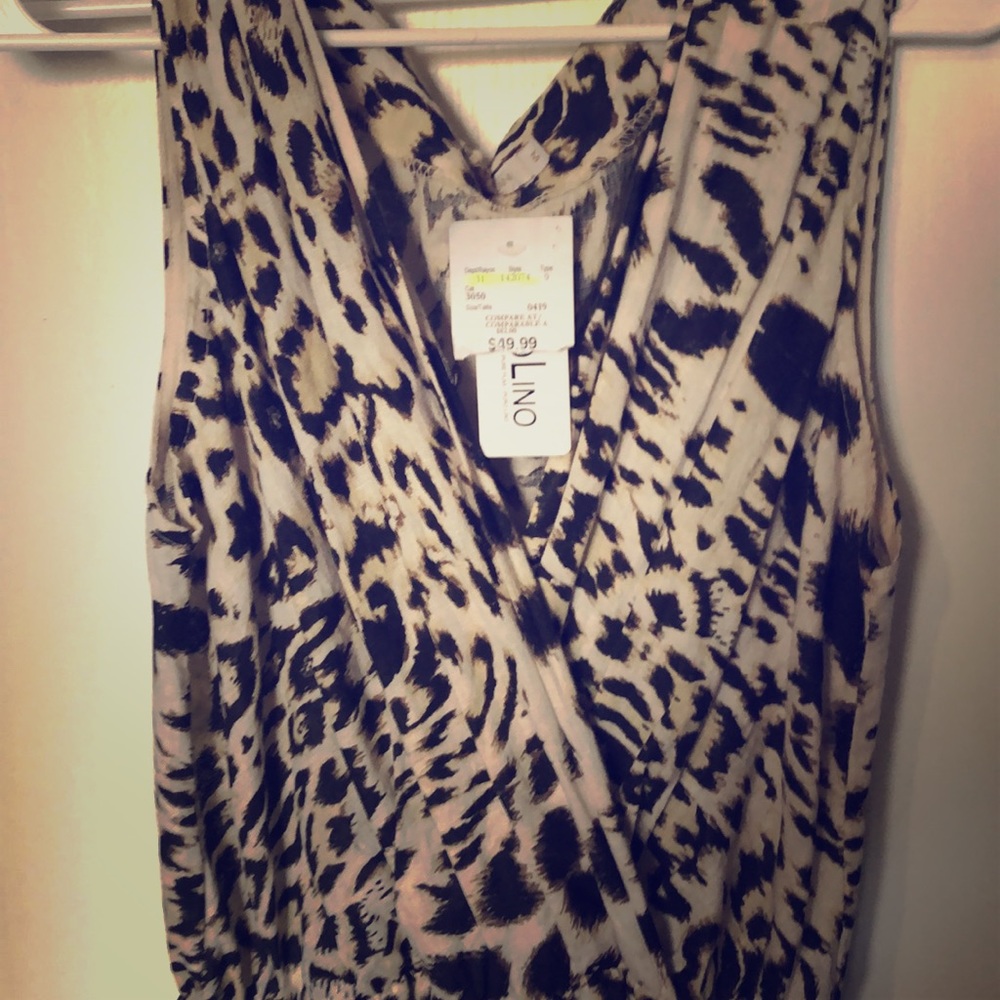 Romper! New with tags . Size M. Never worn
